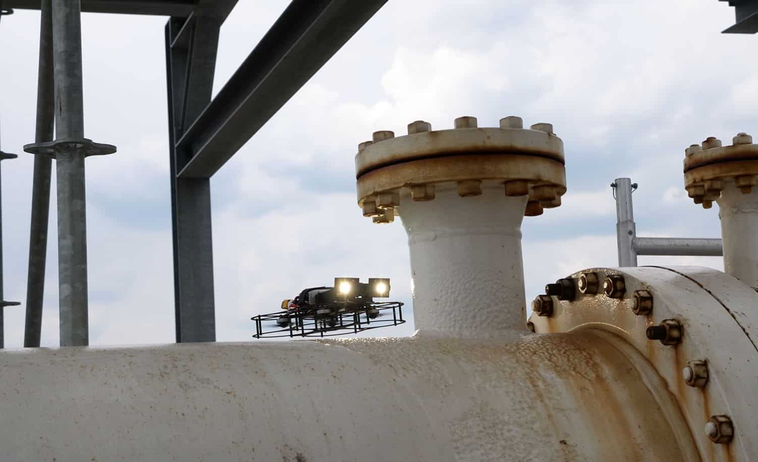FPV drone filming a hard-to-reach weld up close during the challenge.