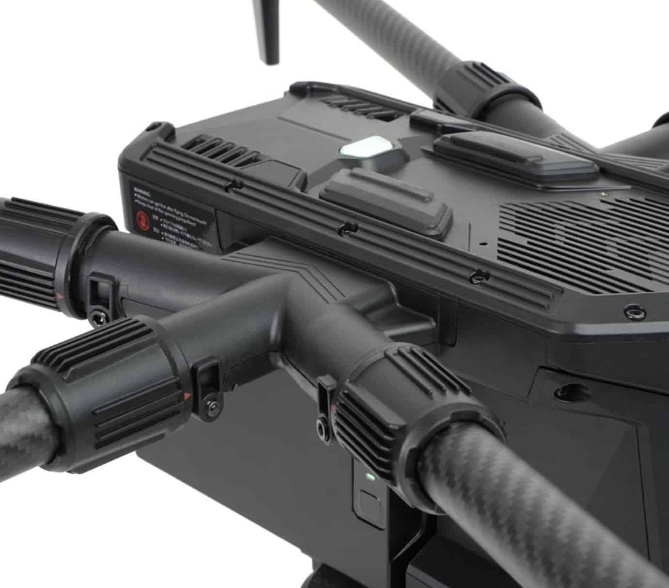 Close-up of the H850 fuselage where carbon fiber arms clamp into the body.