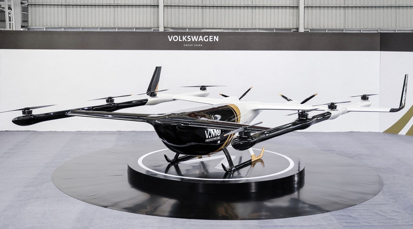 Volkswagen V.MO eVTOL prototype displayed on a black stand at an event.
