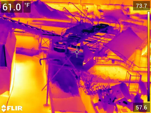 FLIR thermal image of industrial machinery with a Fahrenheit temperature scale.