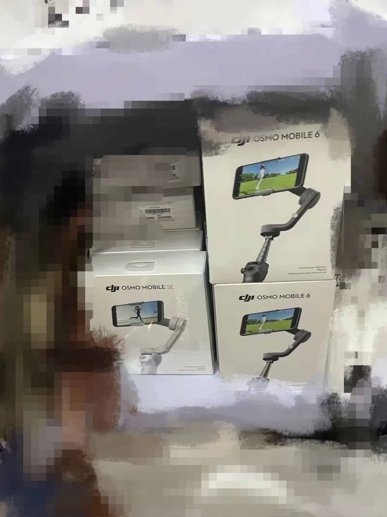 Leaked photo of stacked DJI Osmo Mobile 6 retail boxes on a shelf.