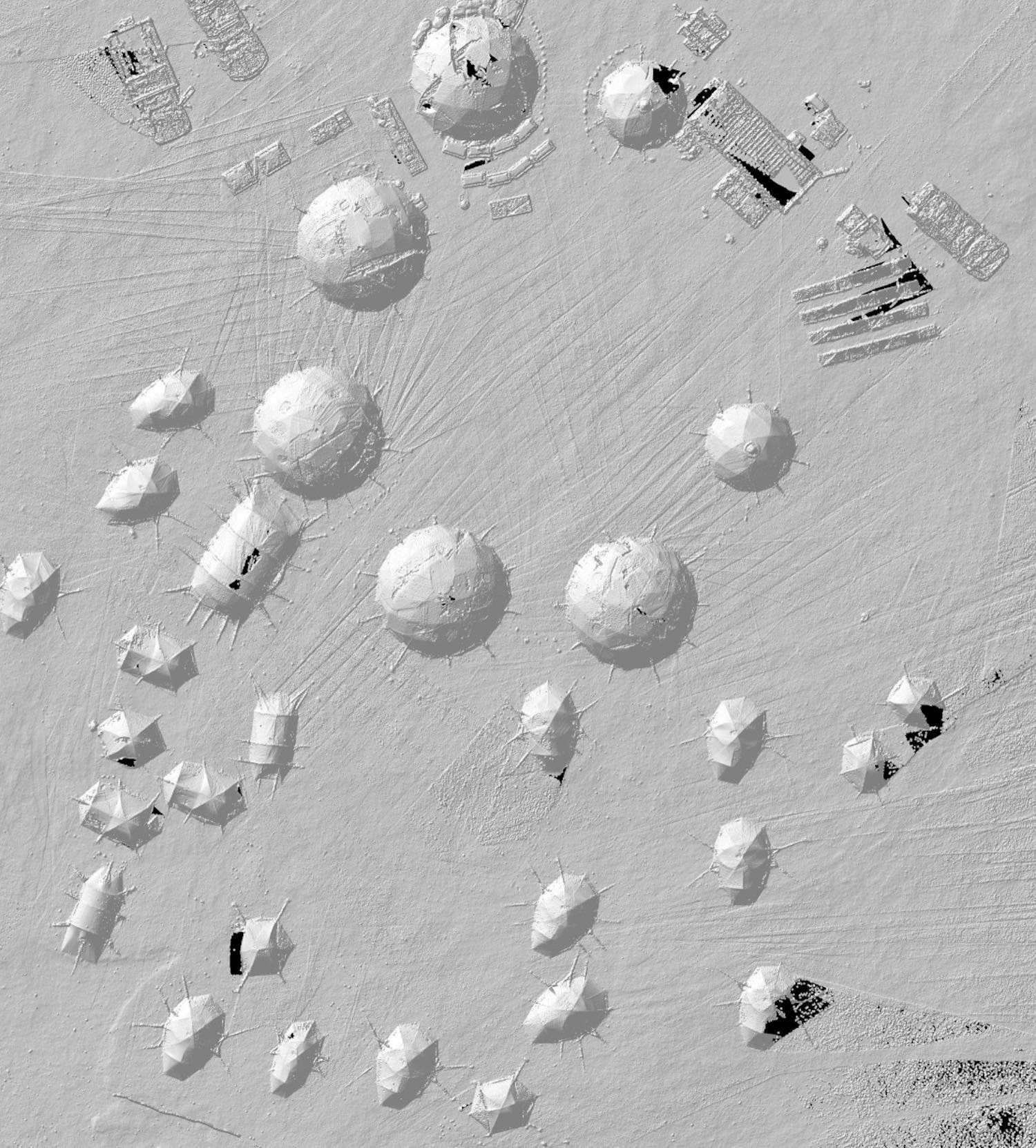 LiDAR scan of a field camp showing tents, tables and solar panels.