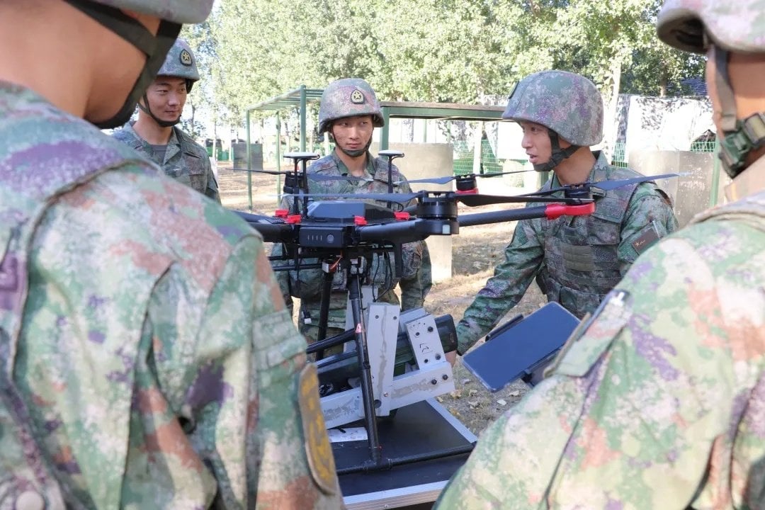 Chinese military arms DJI Matrice 600 with automatic gun for attack drone training