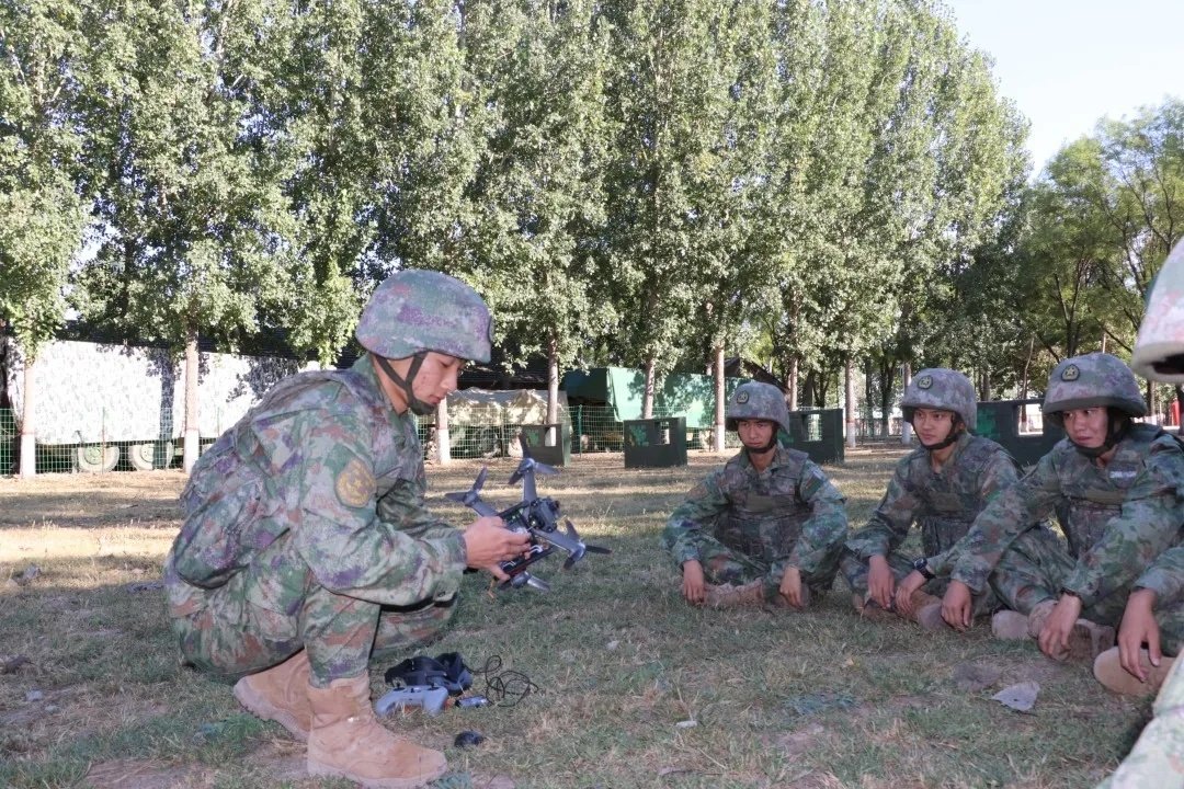Chinese military arms DJI Matrice 600 with automatic gun for attack drone training
