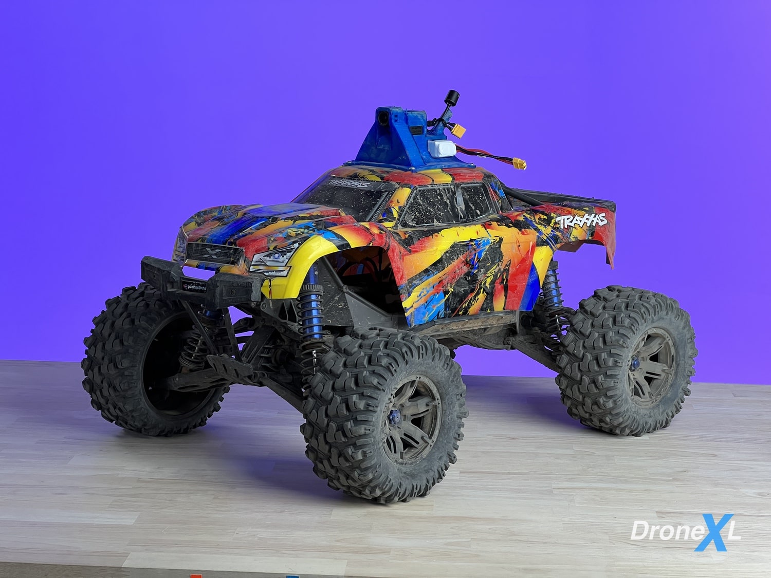 DJI O3 Air Unit in a 3D-printed TPU cradle on a Traxxas X-Maxx RC truck.