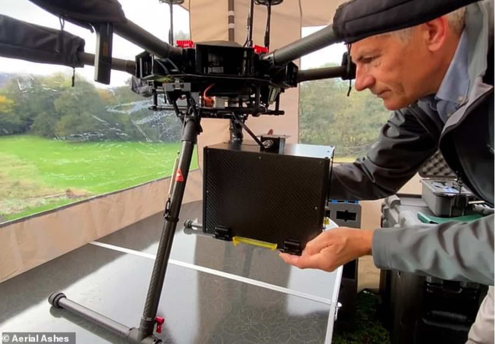 The black container holding a loved one's ashes fitted beneath the drone.