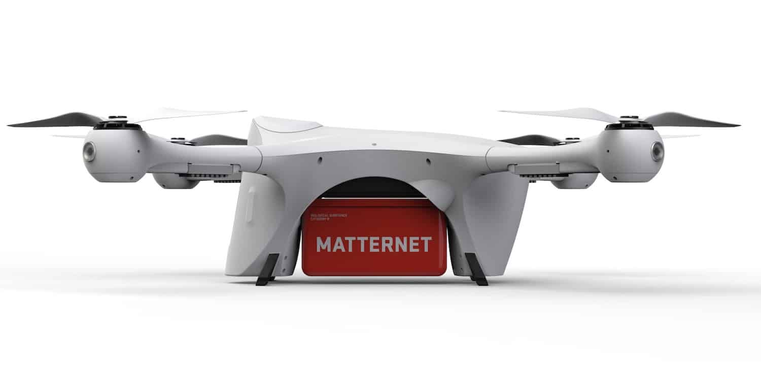 Matternet M2 delivery drone with its red payload container attached.