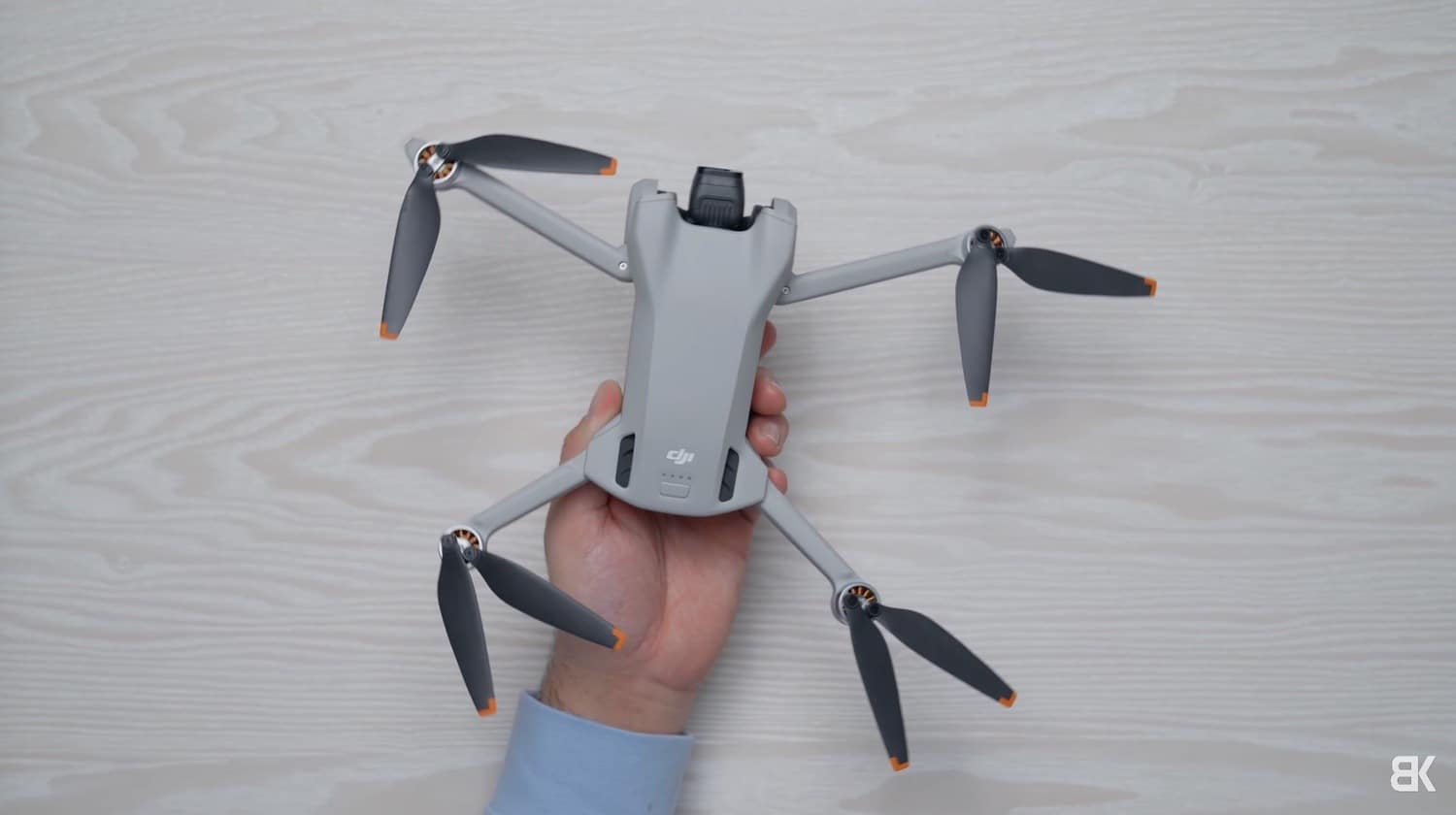 DJI Mini 3 in hand, light enough to skip registration in most countries.