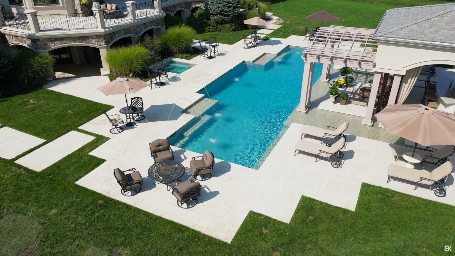 Aerial view of a listing property with the cars cleared from the driveway.