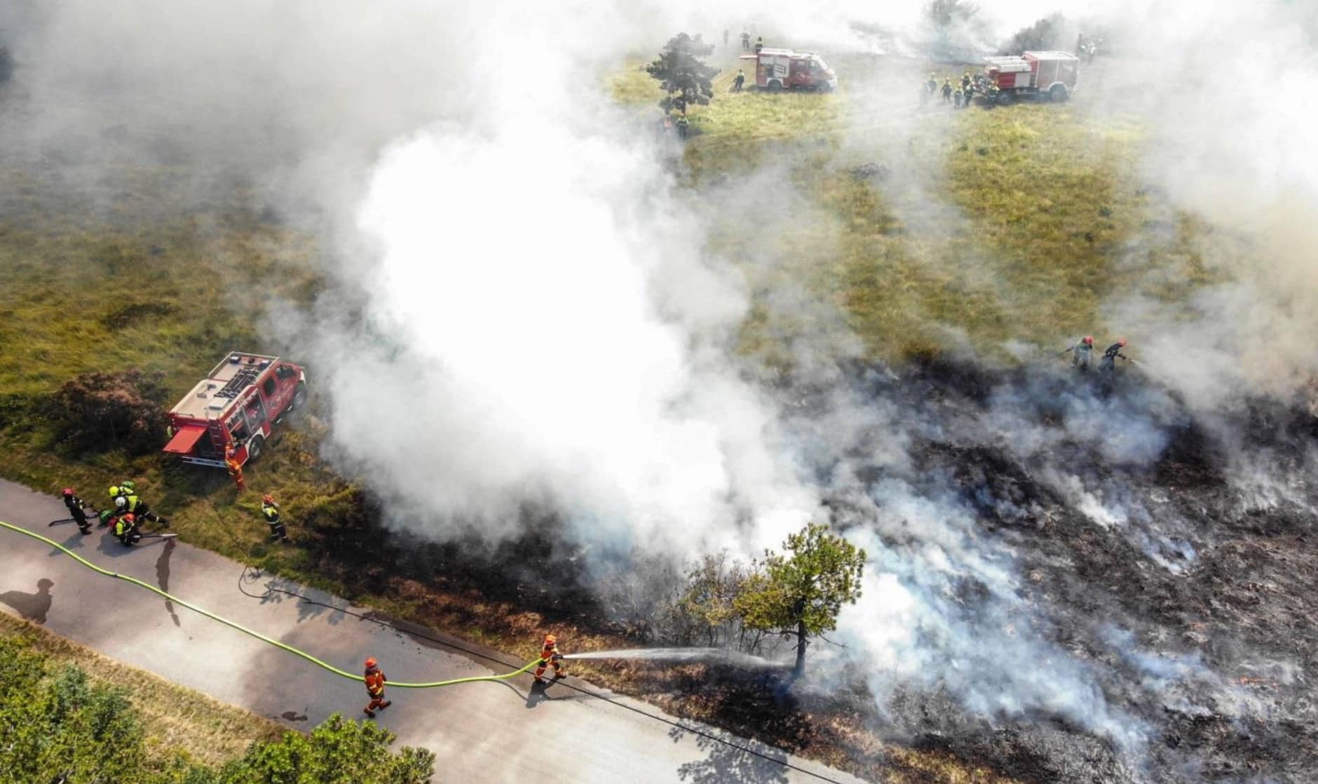 Fire service drone crew using a thermal camera at an incident scene.