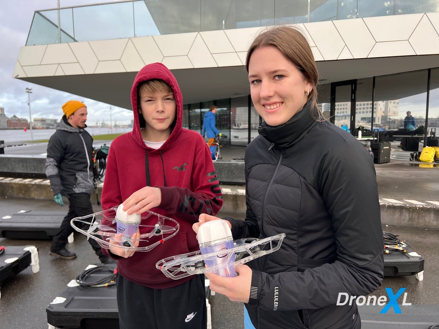 Damien and Naomi Kesteloo inspect the drones, which are remarkably light while being able to withstand wind speeds of up to 11 meters per second.