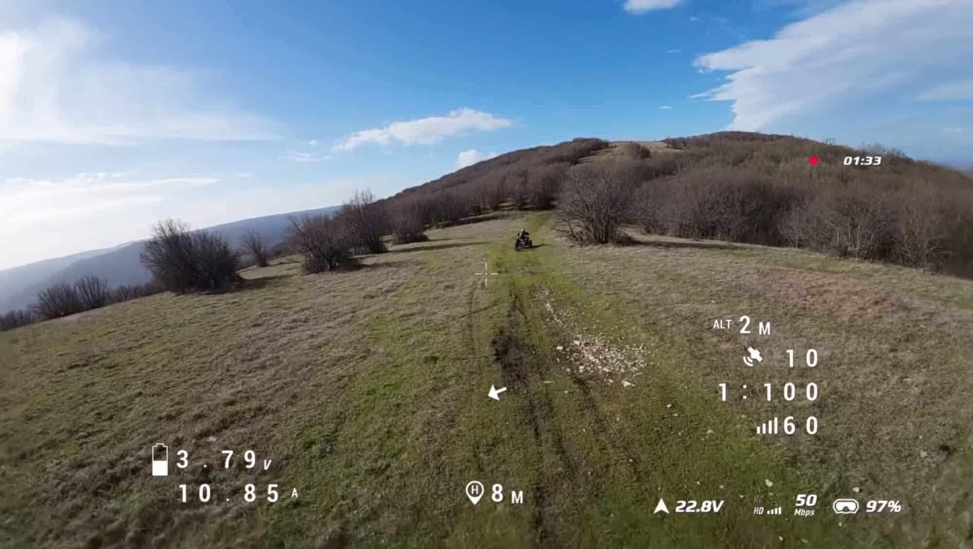 Remote hilltop trail reached by dirt bike before the long-range flight.
