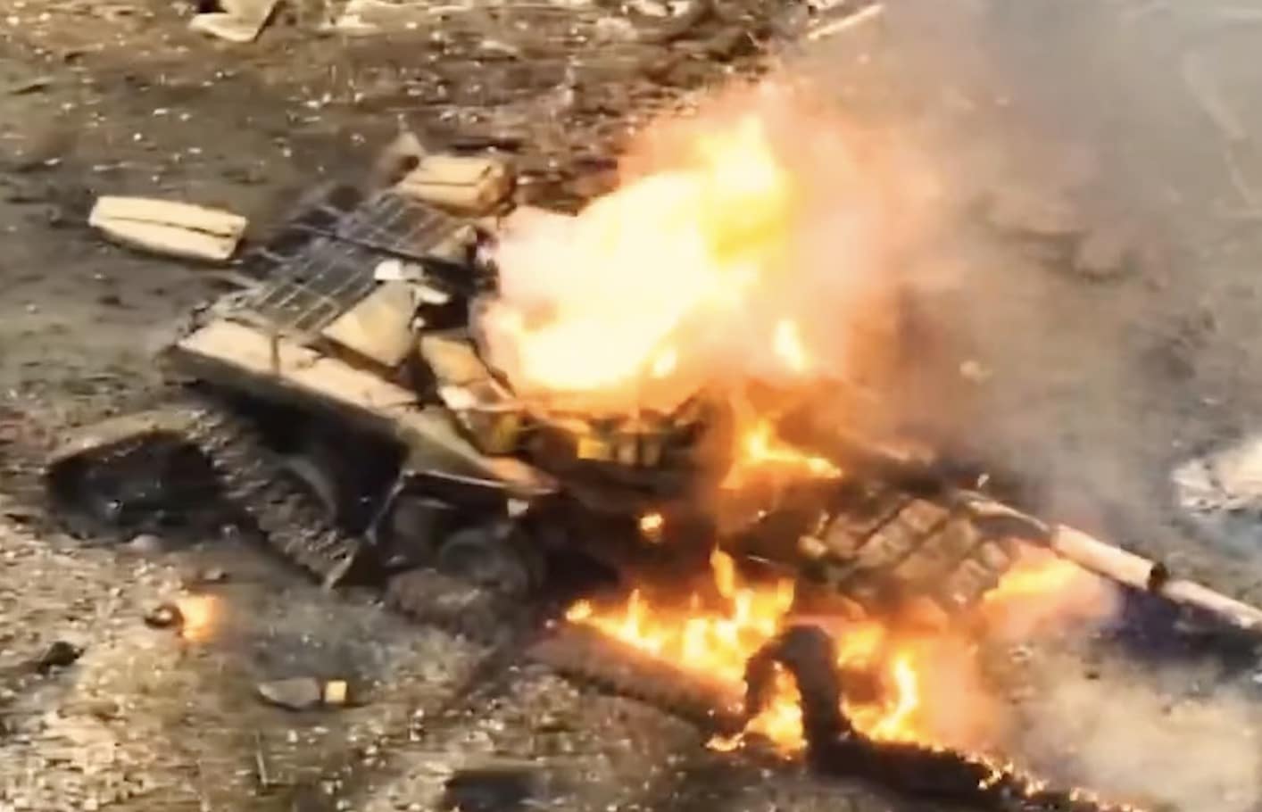 Two T-64 tanks and a T-72 seen from an FPV quadcopter lining up above their turrets.