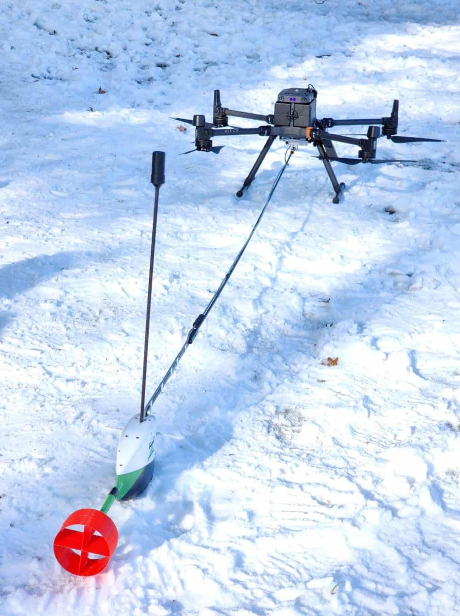 Vertical view of the DJI Matrice 300 towing the Aquamapper sensor across Lac de Bret.