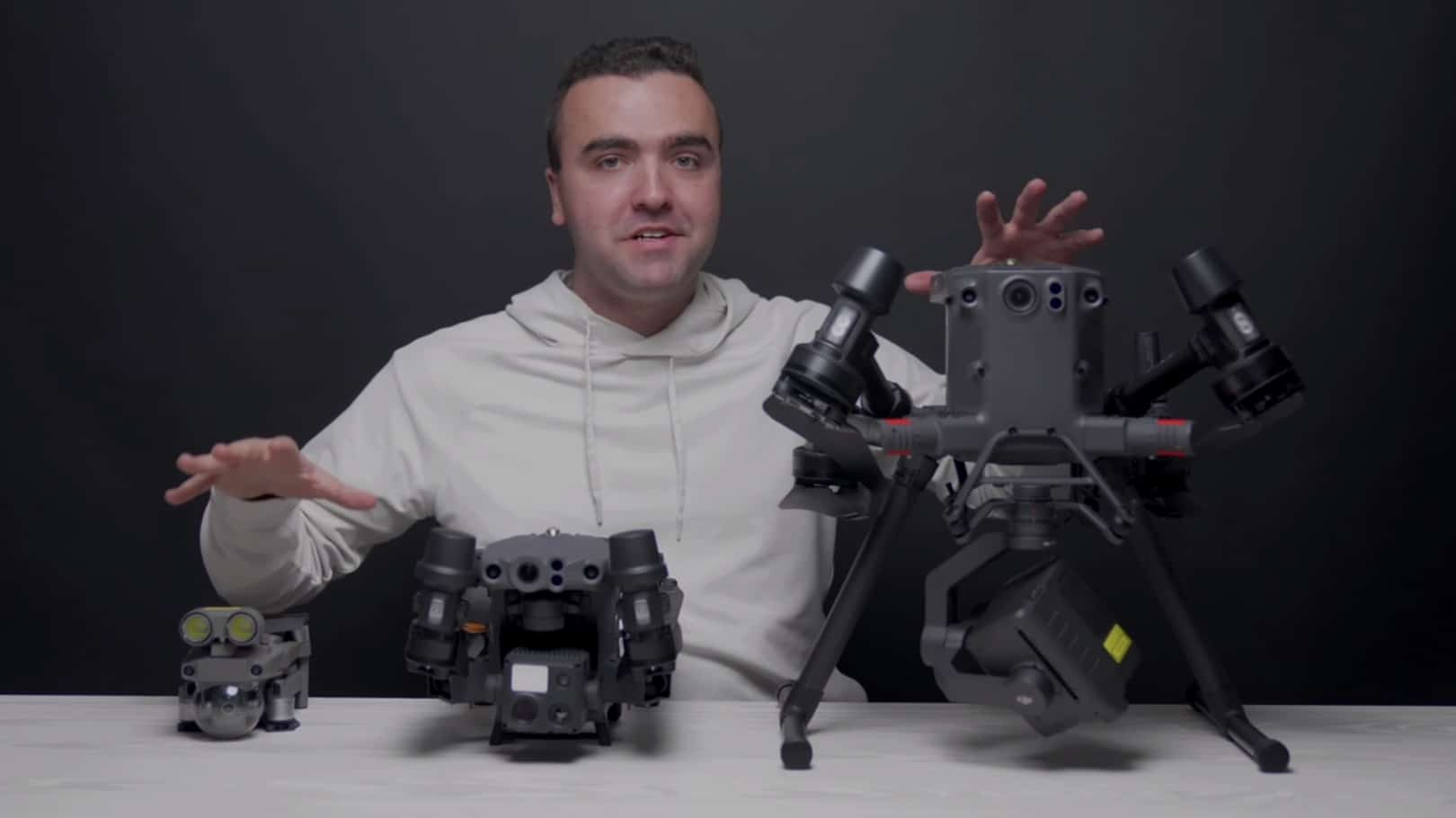 DJI Matrice 30 sitting between the larger M300 and the smaller Mavic 2 Enterprise Advanced.
