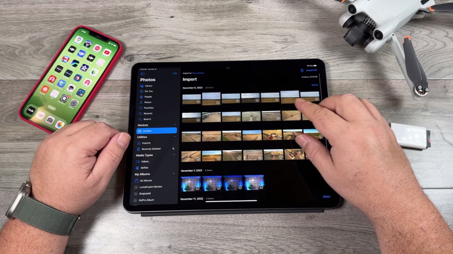 Apple Photos on an iPad importing drone clips from the connected memory card.