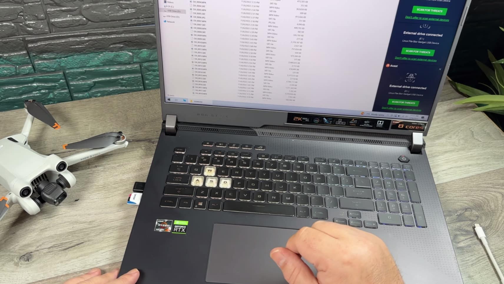 Lexar card reader used to move Mini 3 Pro footage onto a laptop.
