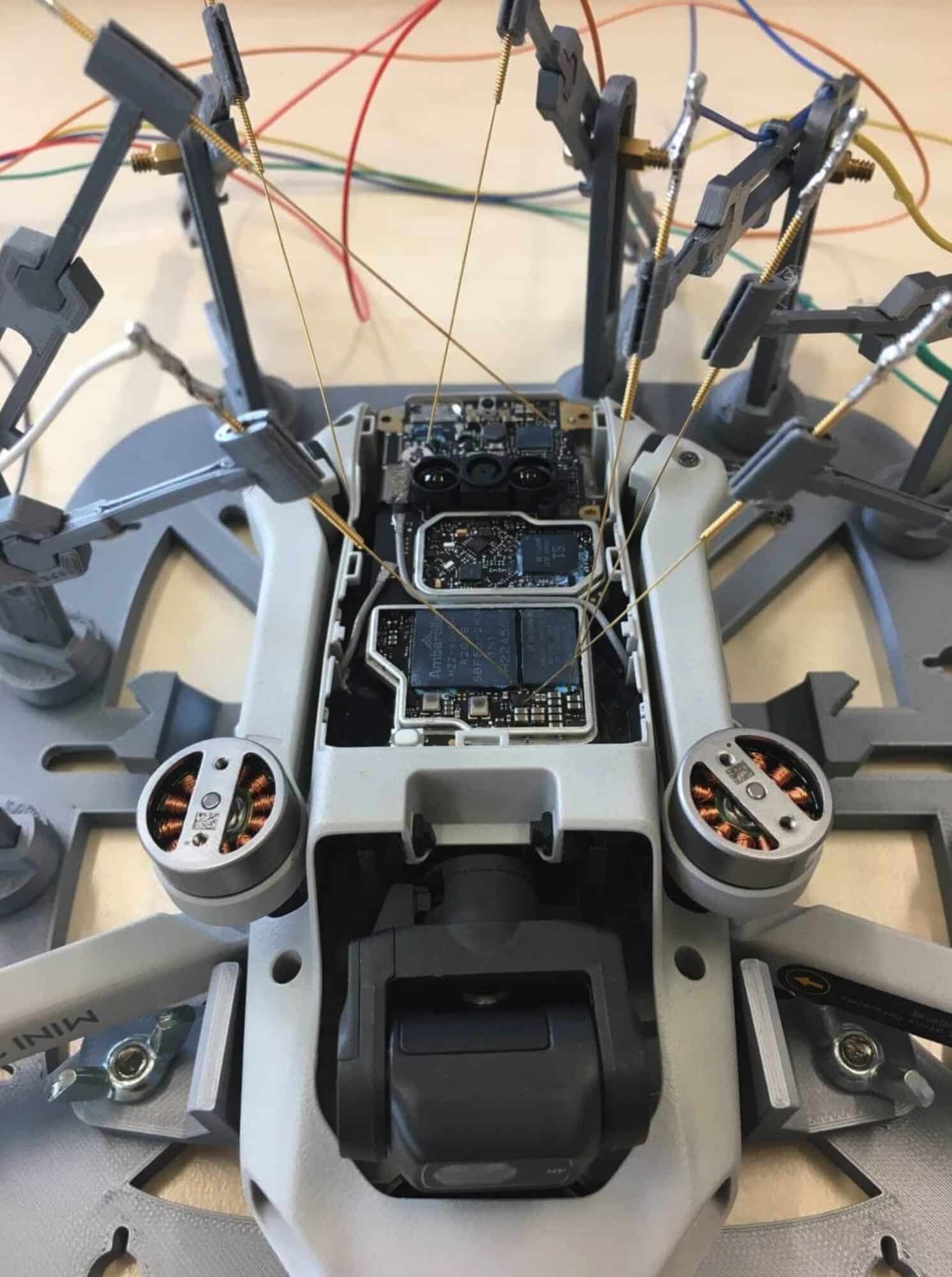DJI Mini 2 opened up and wired to probes for radio signal analysis.