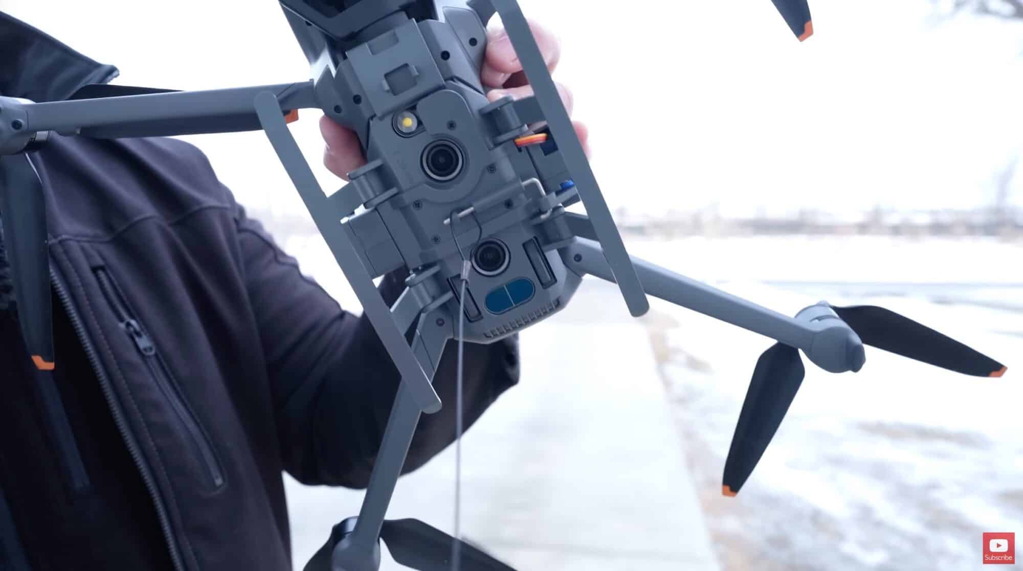 The DJI Mavic 3 lifting a DJI Avata on a steel braided cable.