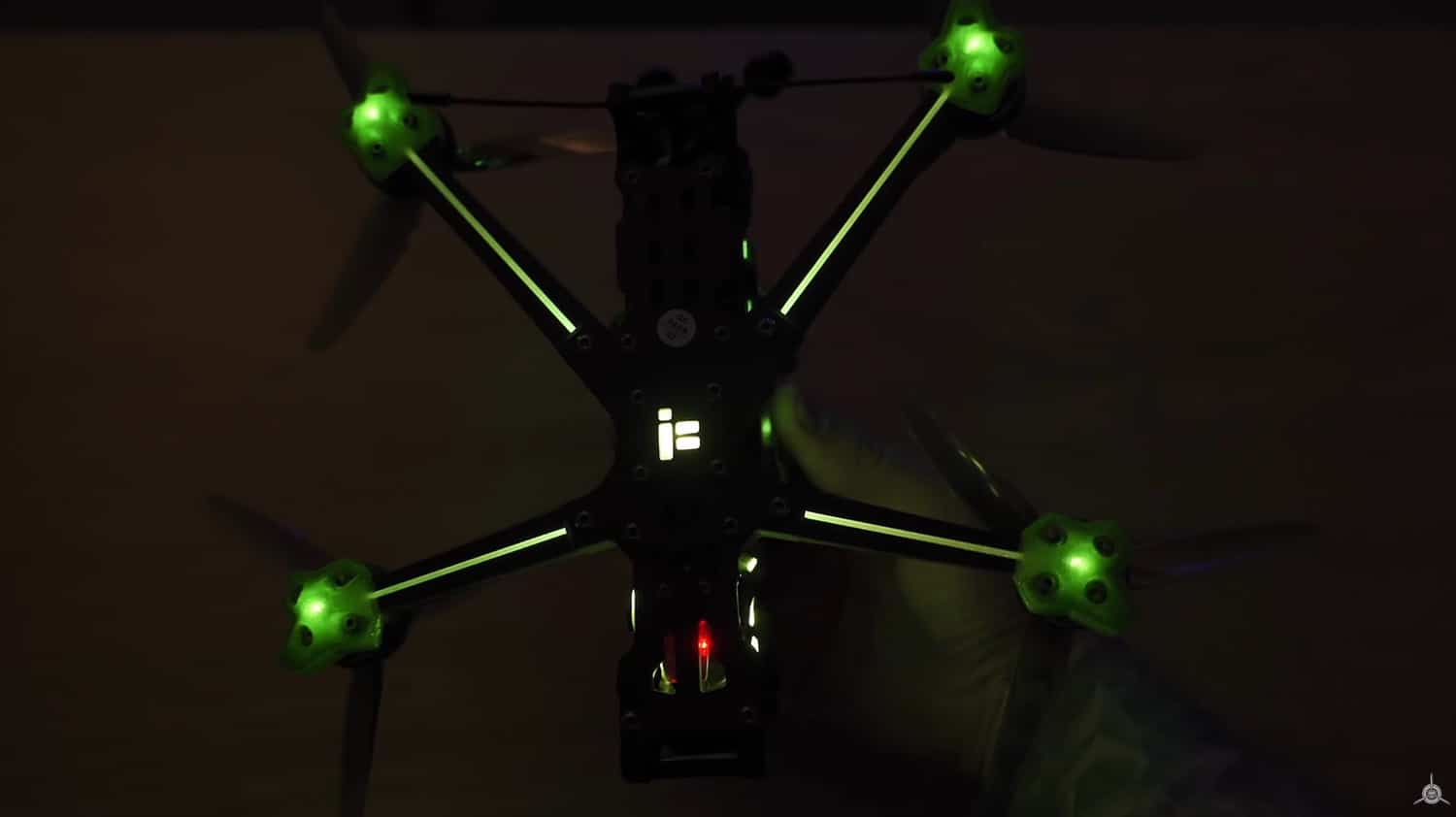 Custom freestyle build on the Quadmula Siren F5 frame in green and silver.