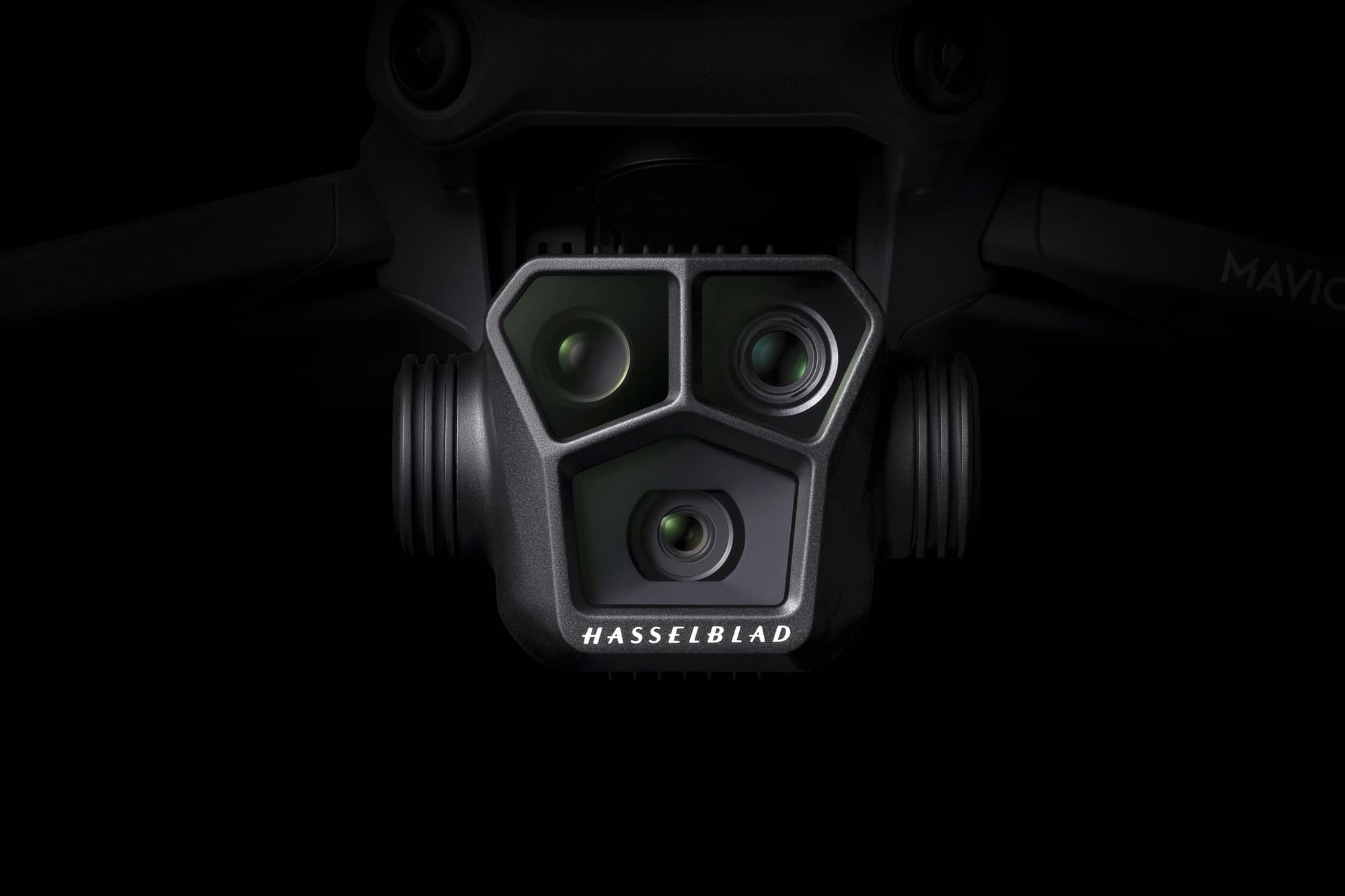 Close view of the Mavic 3 Pro gimbal holding 24, 70 and 166 millimeter lenses.