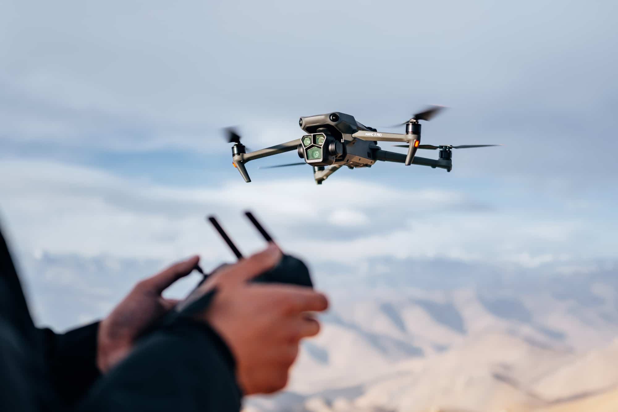 DJI Mavic 3 Pro paired with the DJI RC Pro controller in a lifestyle press image.