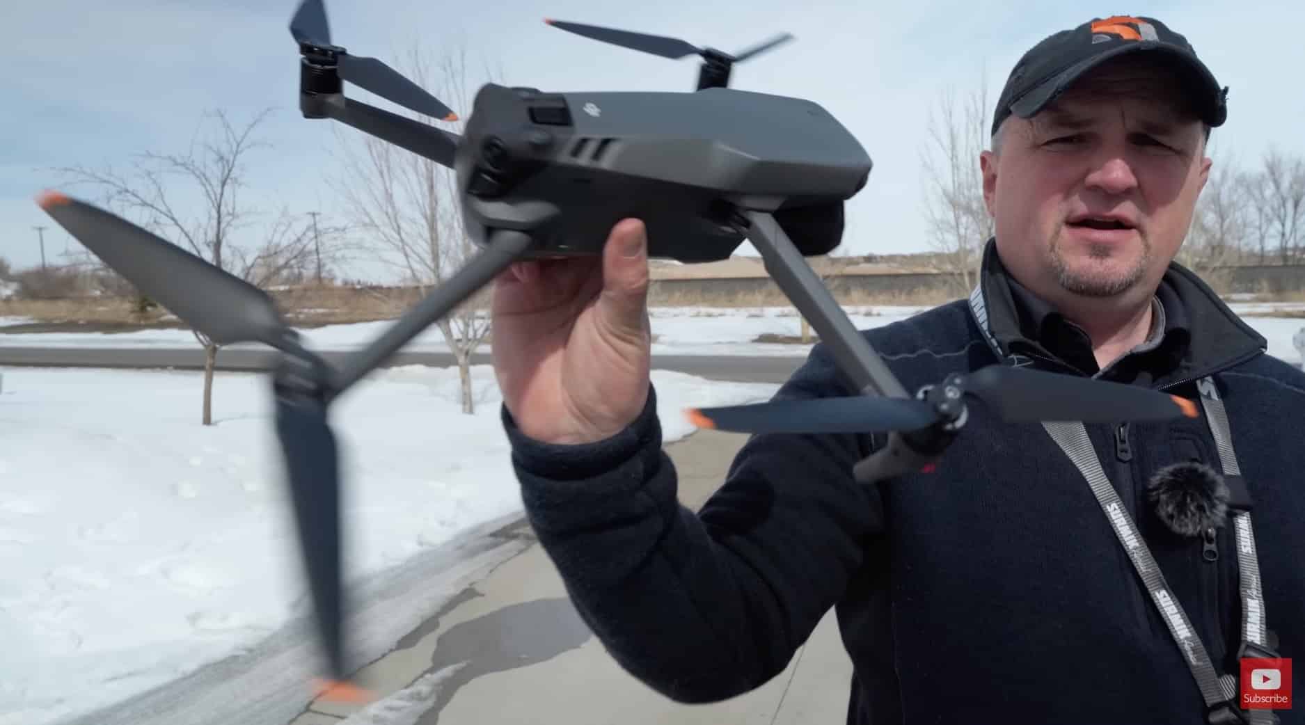 Correct finger placement on the underside of the drone before hand launching.