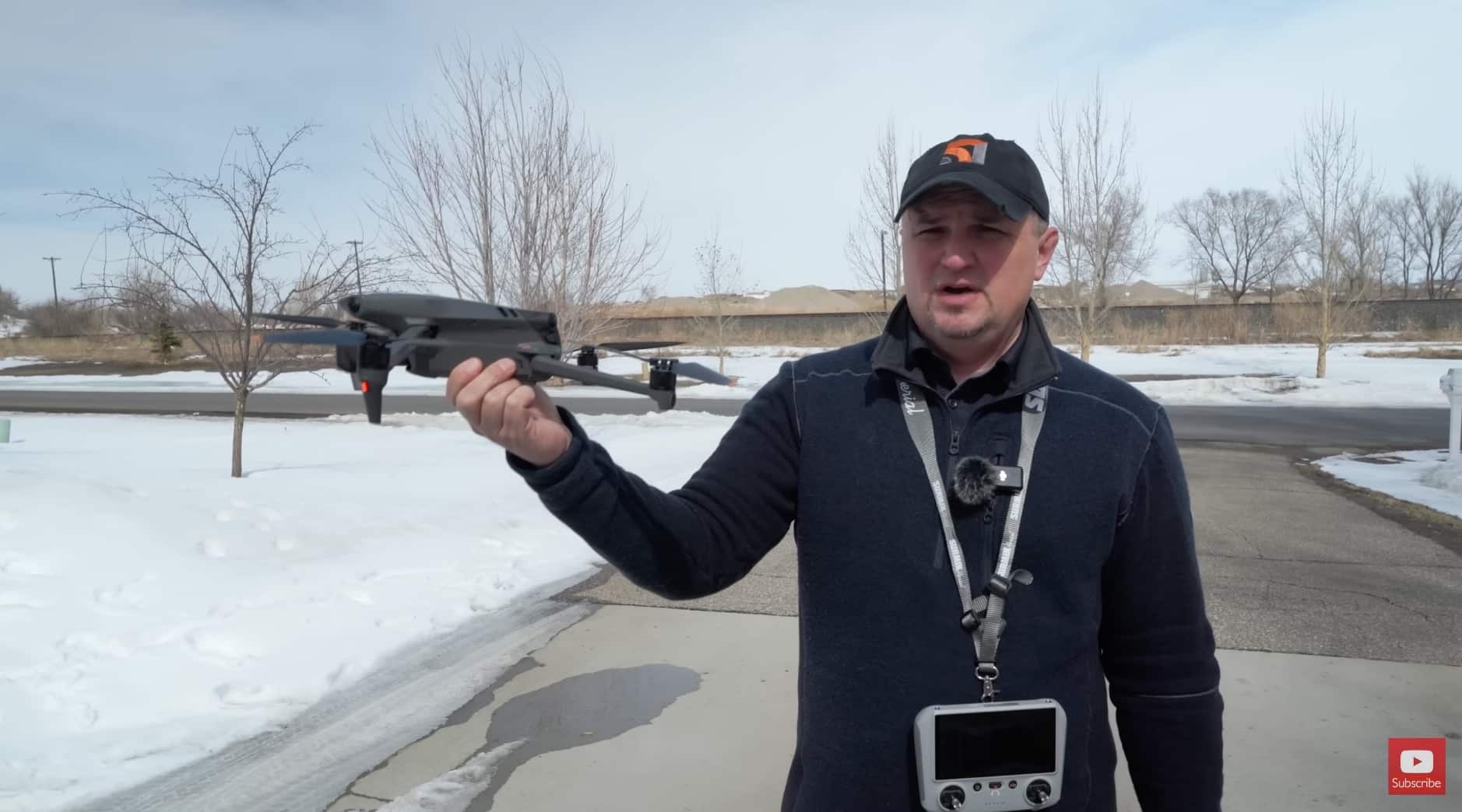 Drone held away from the body at a 45-degree angle ready to launch.