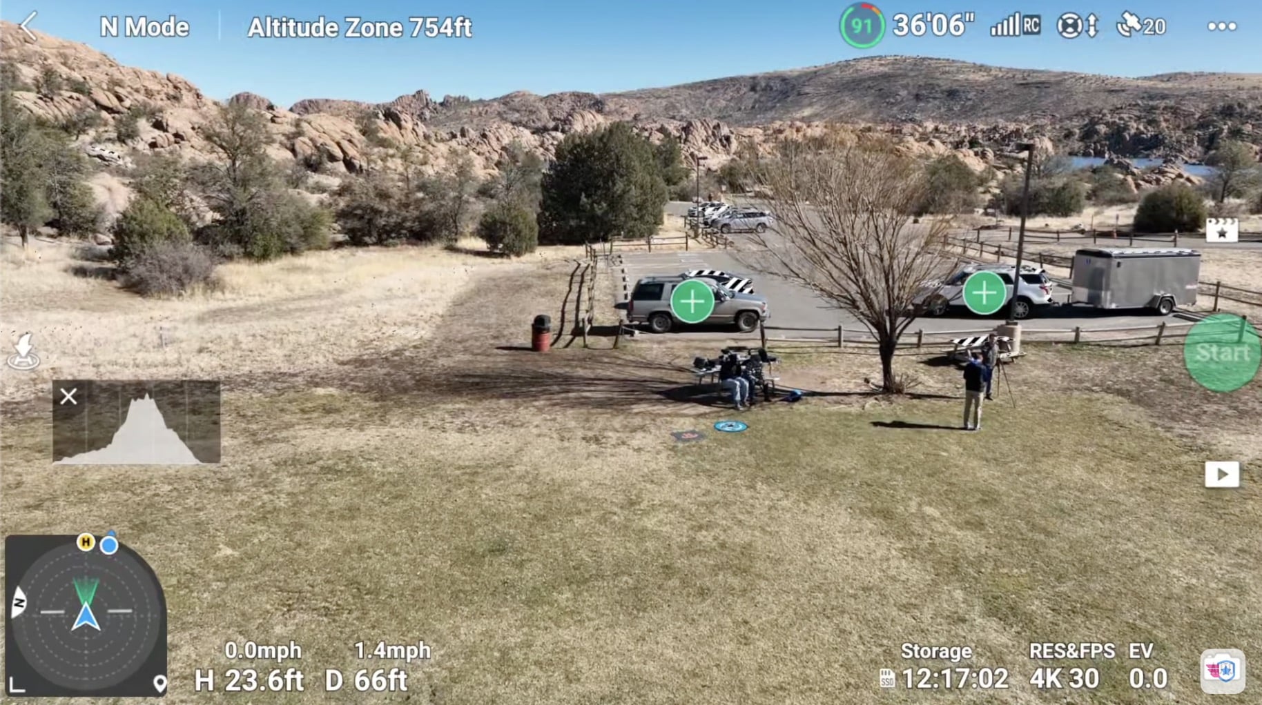 Flight app screen over desert terrain showing altitude zone and remaining flight time.