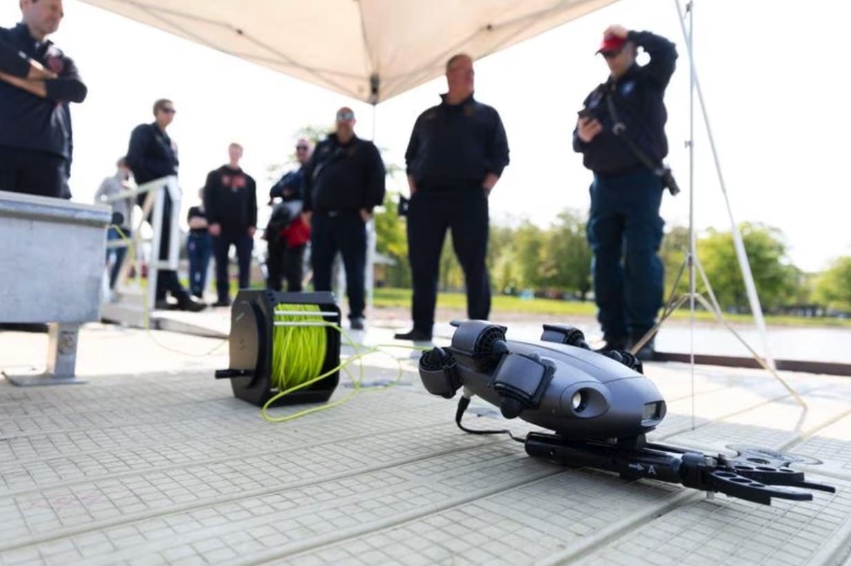 Summit Township firefighters demonstrate an underwater rescue drone at Vandercook Lake.