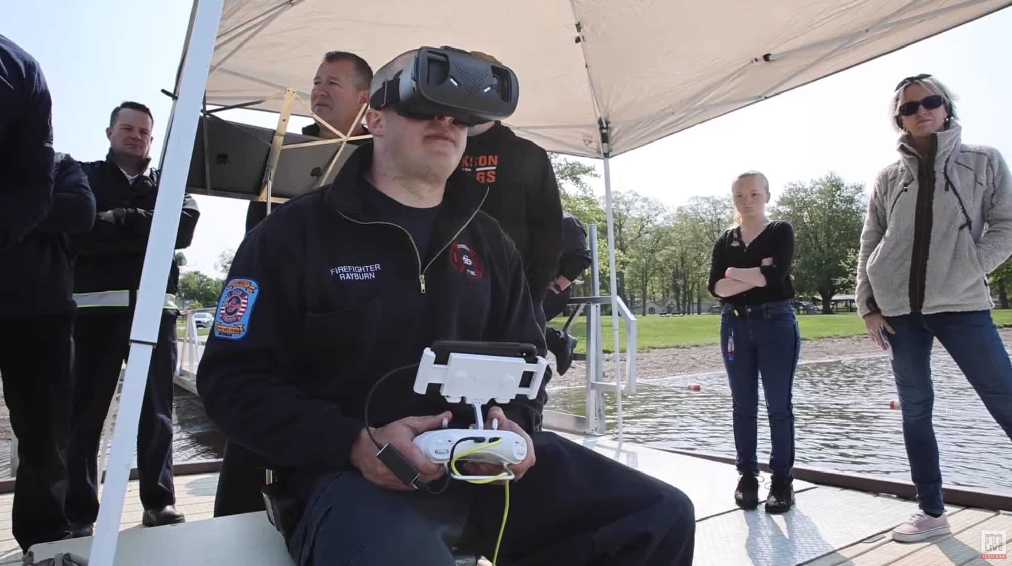 Firefighters Joseph Rayburn and Donovan Green operate the underwater drone during the demonstration.