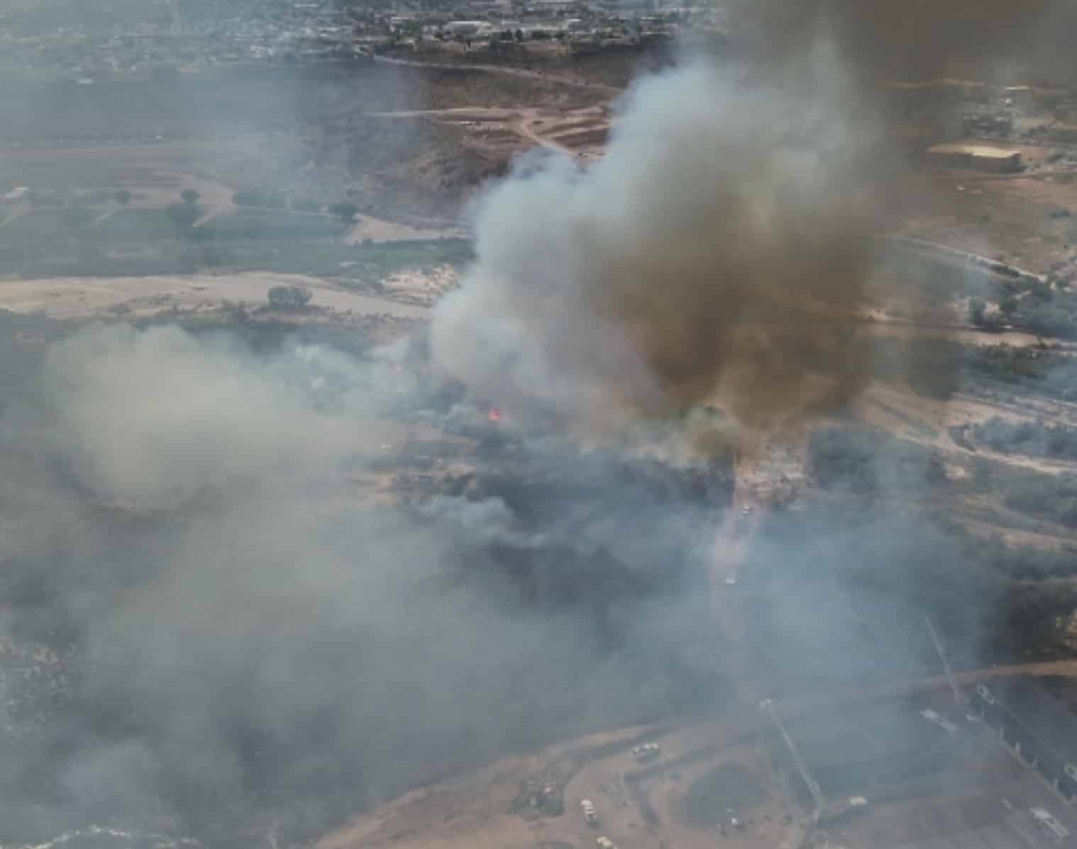 Aerial view of smoke rising from the brush fire near the Virgin River.