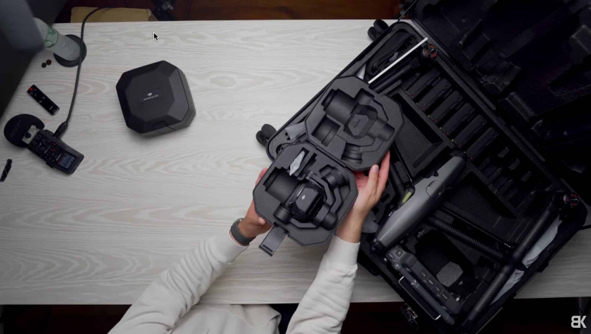 X9 8K Air full-frame camera lifted out of its own padded case.