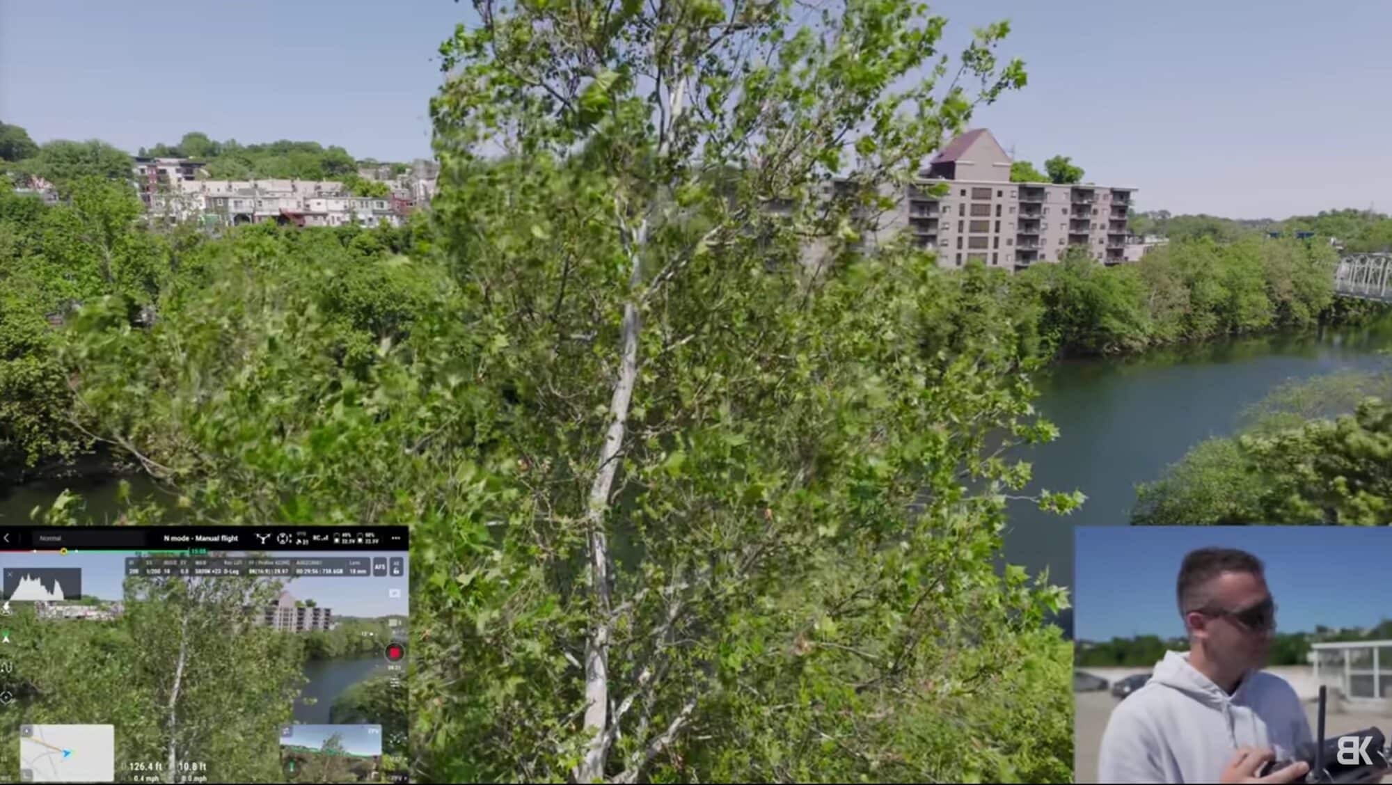 DJI Inspire 3 hovering near trees as its obstacle sensors hold it back.