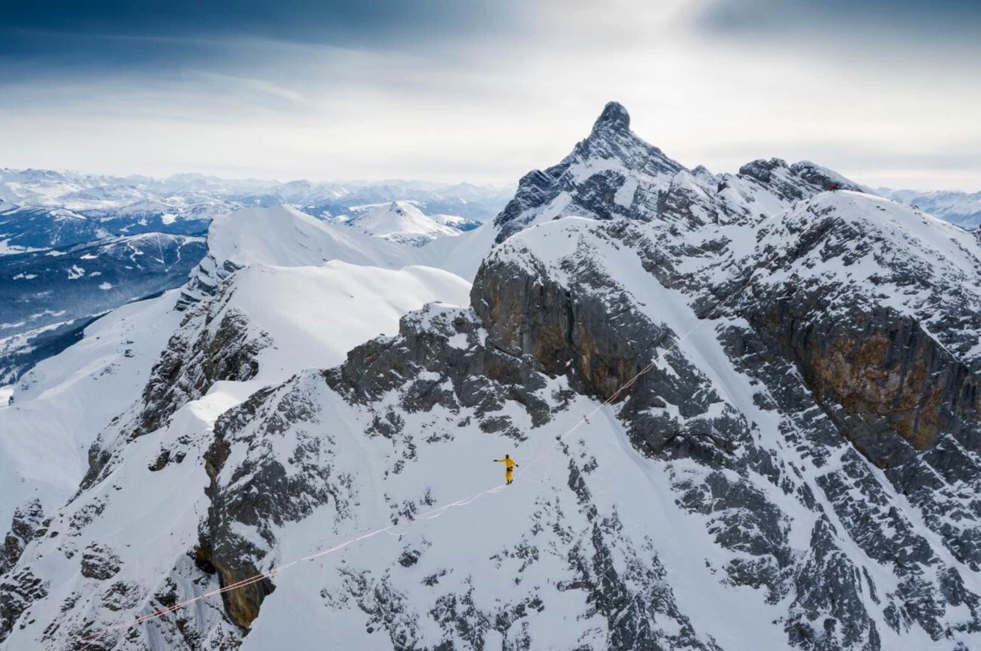 Highline by David Machet. In the bitter cold of January 2021, the celebrated highliner, Nathan Paulin, managed to traverse a 200-meter long and 2.5cm wide highline at Pointe d’Areu in the Aravis range, positioned at a height of 2,460 meters. This remarkable feat took three days and the concerted input of a six-person team to accomplish, marking it as a first in the world.