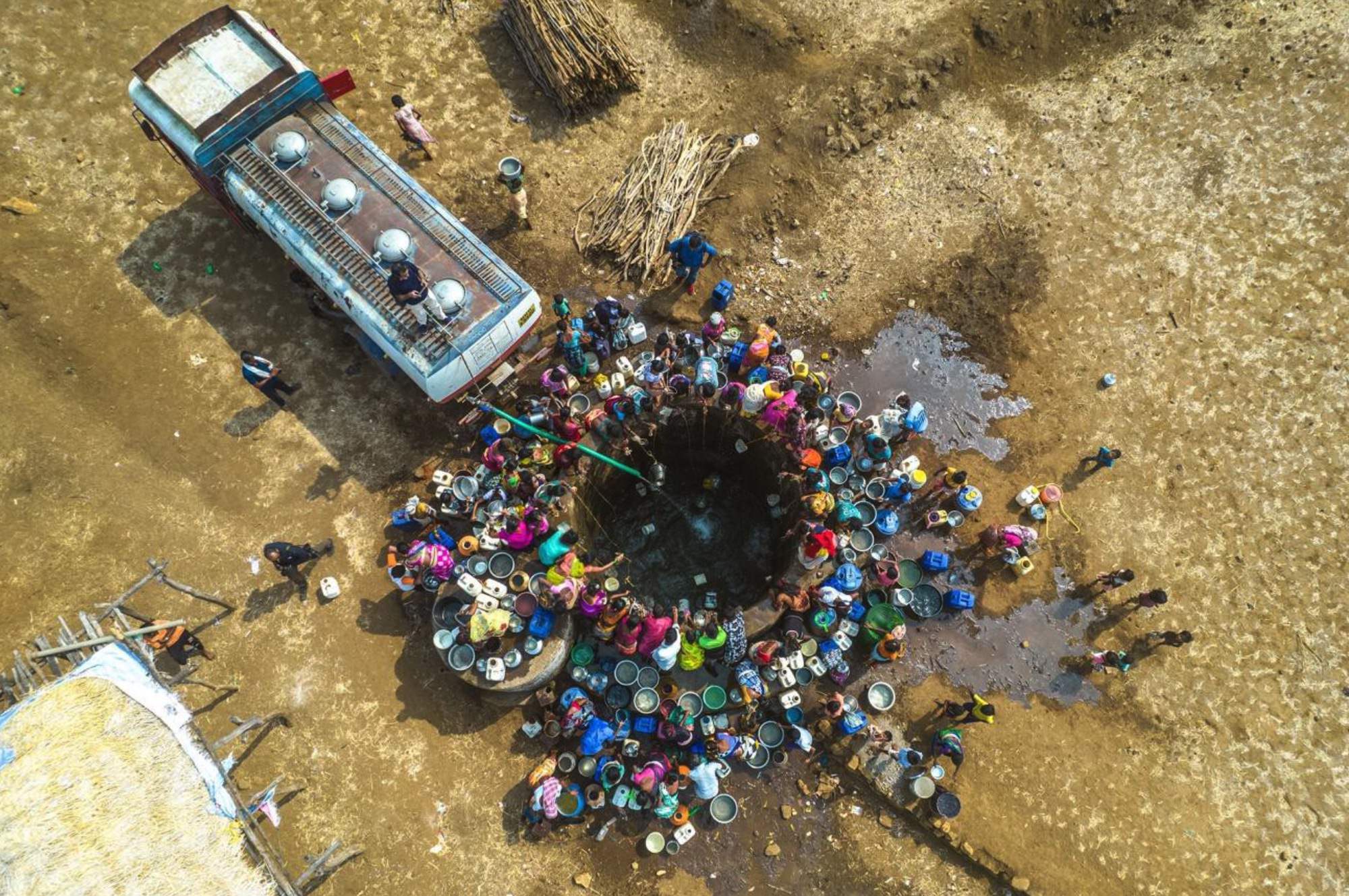 Fight For Thirst by Pratik Chorge. In Thadacha Pada, a village located in Mumbai's Thane district, locals converge around a depleted well to collect water delivered by tankers. Despite the vicinity of large dams like Bhatsa, Tansa, and Vaitarna, many communities in the area continue to grapple with water scarcity.