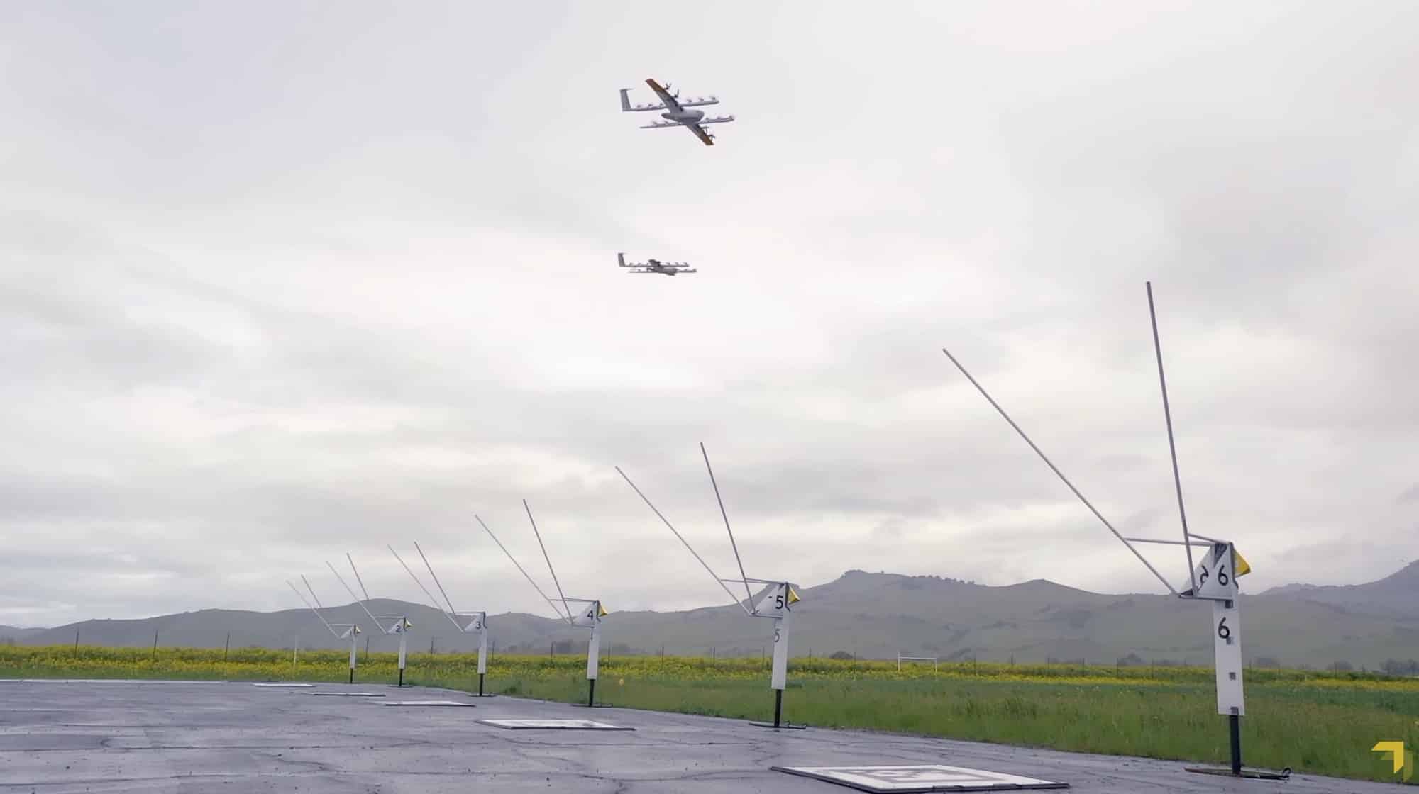 A package hanging from Wing's autoloader, waiting to be collected by a drone.
