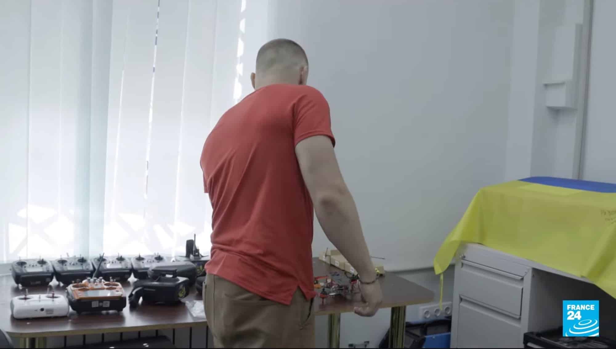 Ukrainian volunteers assembling kamikaze FPV drones for front-line units.