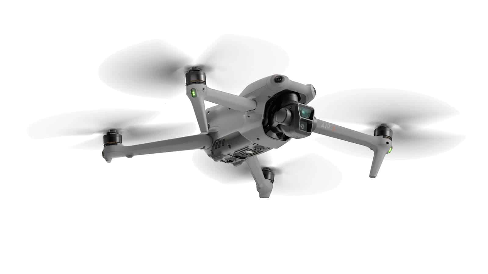 DJI Air 3 viewed from the right and below with blades spinning.