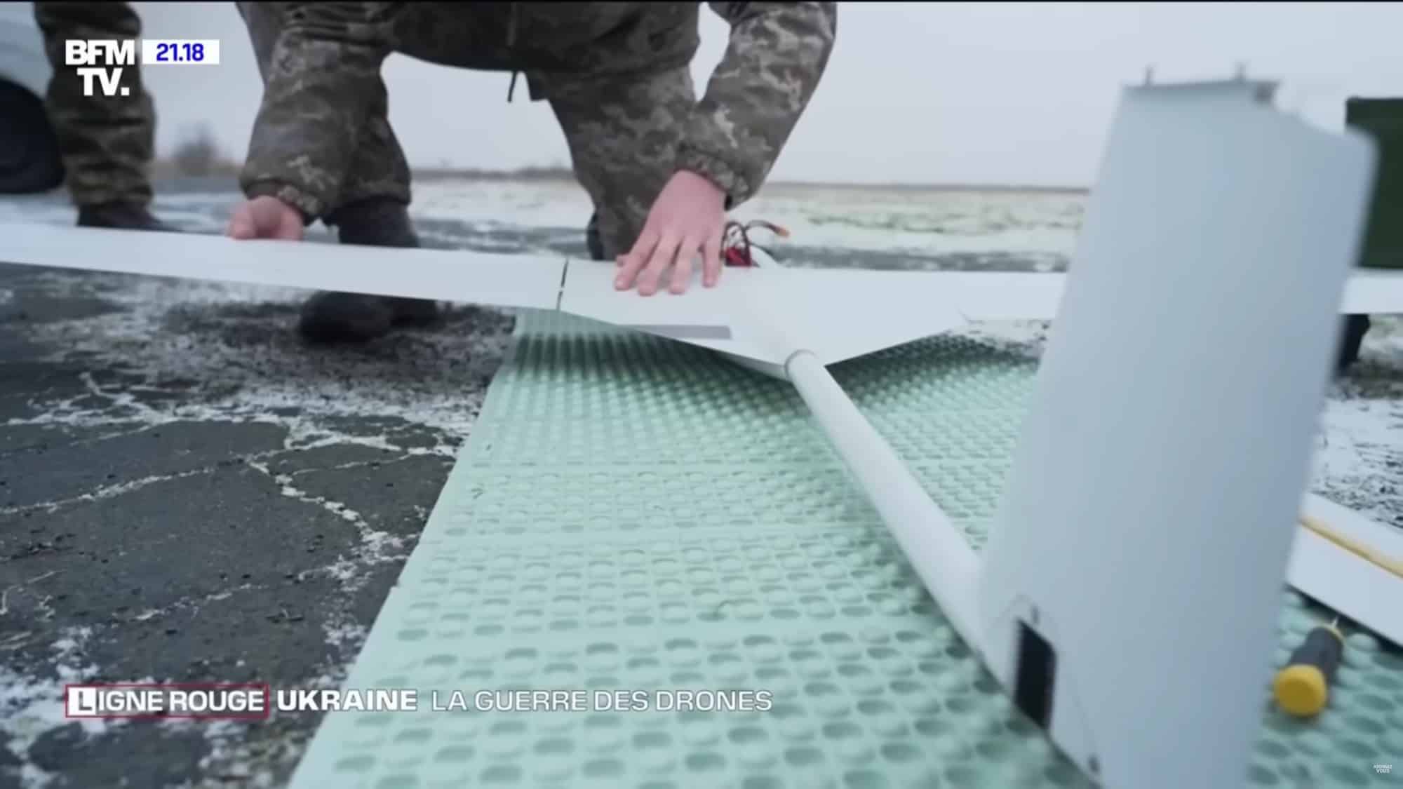Workshop bench where Ukrainian volunteers fit munitions to consumer quadcopters.