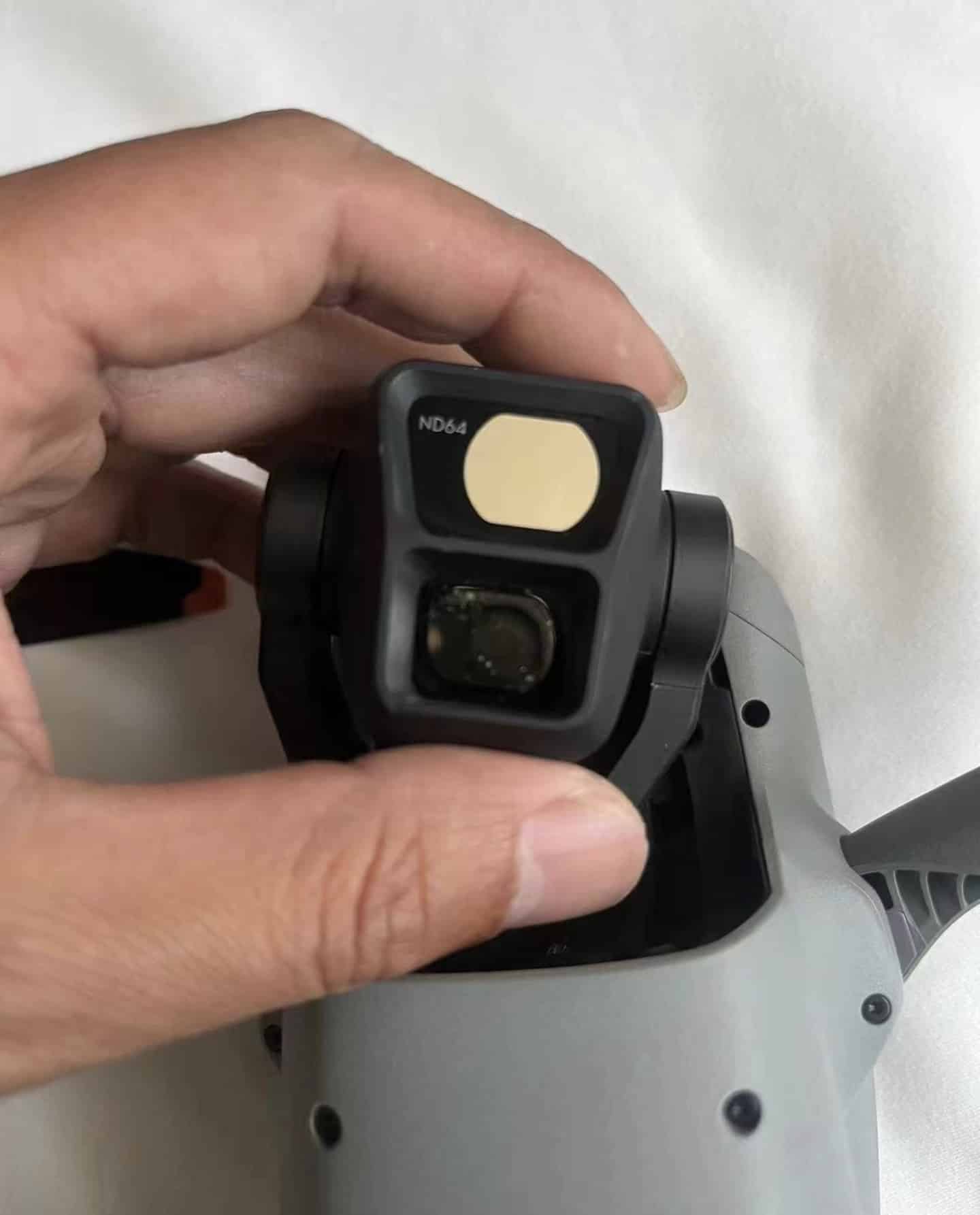 A leaked photo of the DJI Air 3 camera module was shared on Twitter today by DealsDrone. However, details are still scanty due to an installed ND 64 filter which cleverly masks crucial features such as a possible Hasselblad name, field of view, and maximum aperture value.