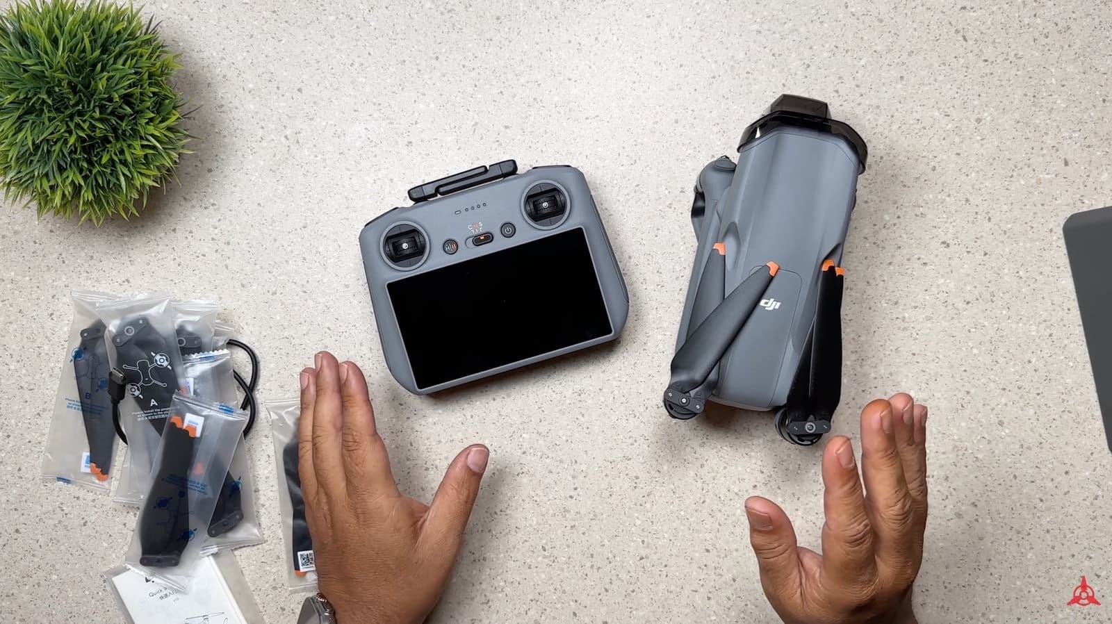 Fly More kit case opened to show the DJI Air 3 and its controller.