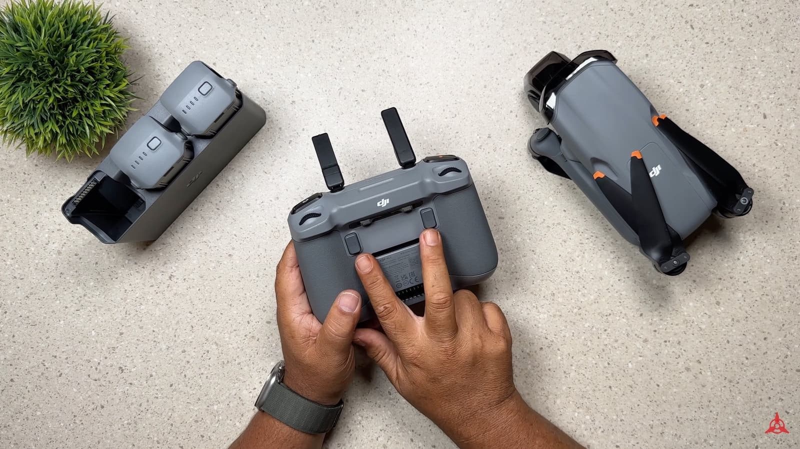 Back of the DJI RC2 with the C1 and C2 custom buttons and stored control sticks.