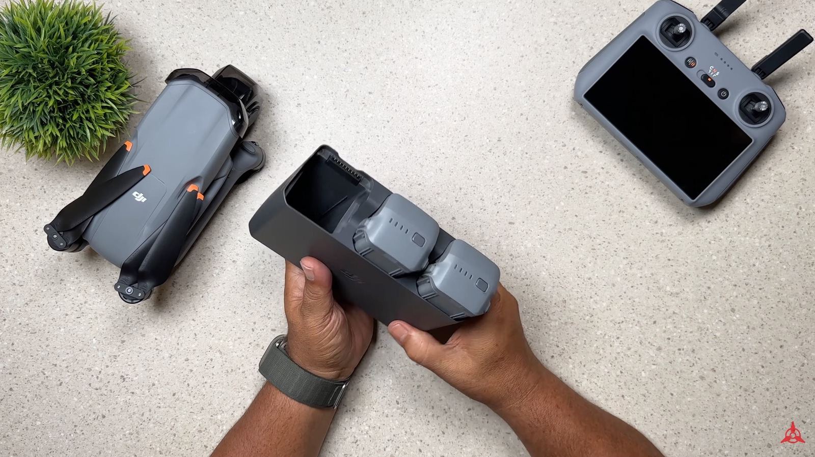 DJI Air 3 battery charging hub with two batteries seated in it.