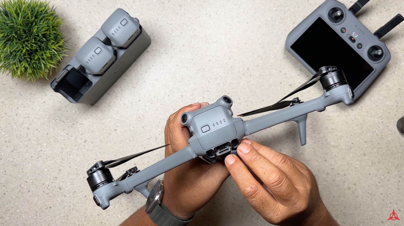 Rear of the DJI Air 3 with the rubber door open over the USB-C port and card slot.