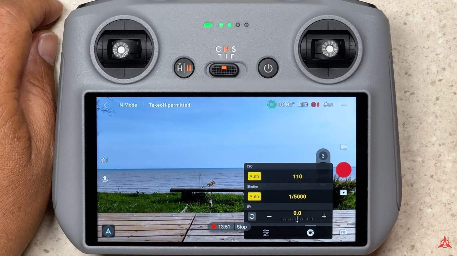 DJI Fly Pro settings panel with manual shutter speed and ISO controls.