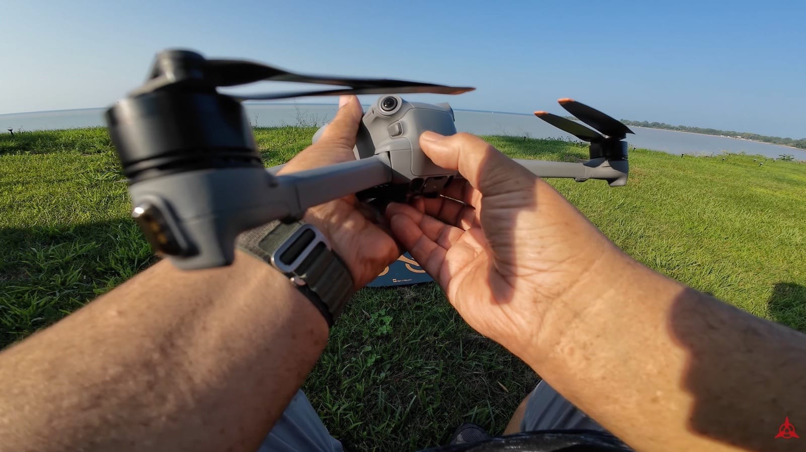DJI Air 3 powered up and set down on a landing pad before takeoff.