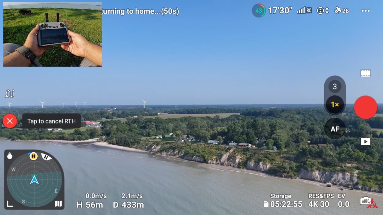 DJI Air 3 flying back to its launch point with the red X available to cancel.