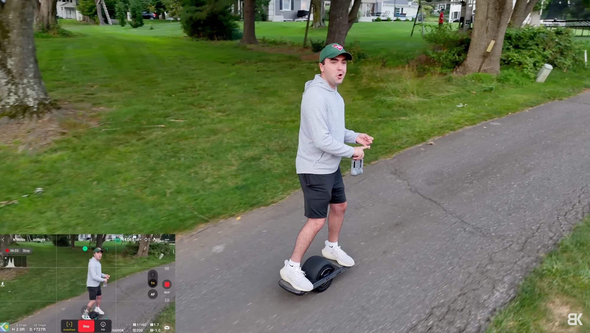 Screenshot of Air 3 ActiveTrack footage following a rider on a onewheel down a road.