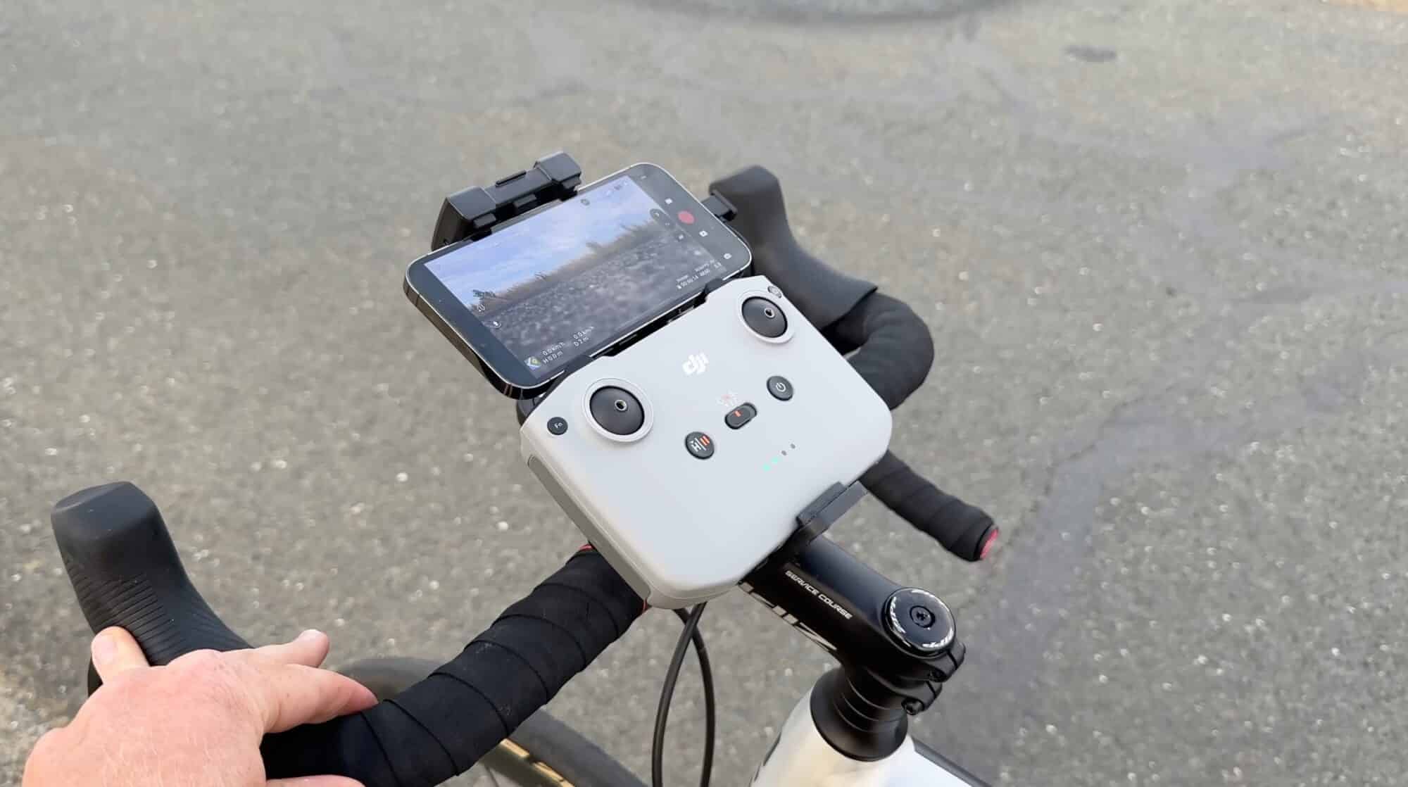 The DJI Air 3 tracking a cyclist along a tree-lined path in ActiveTrack.